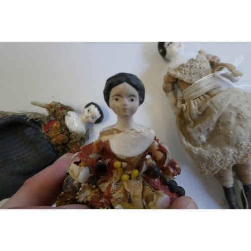 73 - Three Victorian doll's house dolls, comprising two china head dolls with painted features, moulded h... 