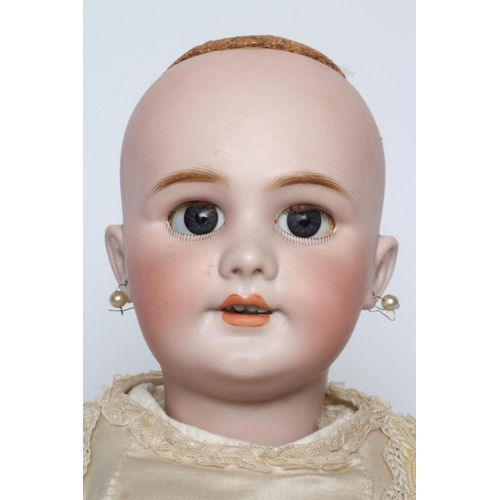 78 - A Tete Jumeau bisque socket head doll, with blue glass sleeping eyes, open mouth, teeth, pierced ear... 