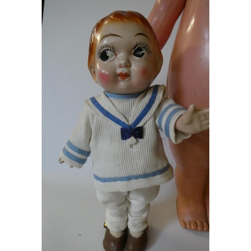 84 - Three large Kewpie type dolls, one 26