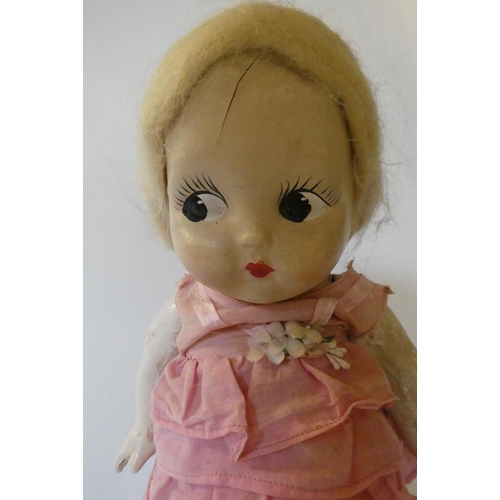 84 - Three large Kewpie type dolls, one 26