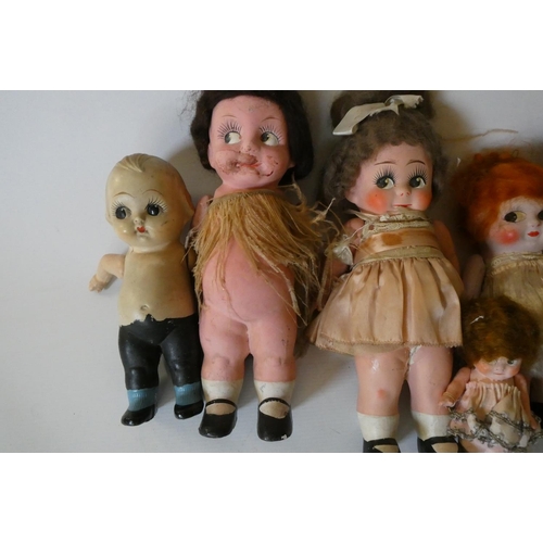 85 - Seven Kewpie type composition dolls, all with jointed shoulders, largest 11