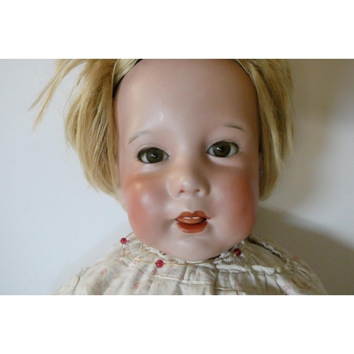 90 - An SFBJ bisque socket head character doll, with brown glass sleeping eyes, open mouth, teeth, trembl... 