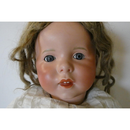 94 - An SFBJ bisque socket head doll, with blue glass sleeping eyes, moulded open mouth with teeth, wood ... 