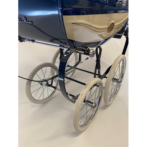 128 - A Silver Cross Millennium Pram, limited edition, No. 0612, with cream and navy painted body, navy ho... 