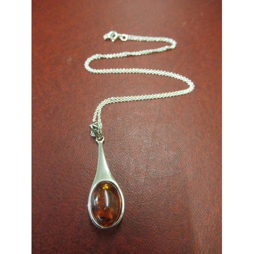 181 - SILVER AND AMBER PENDANT ON SILVER CHAIN