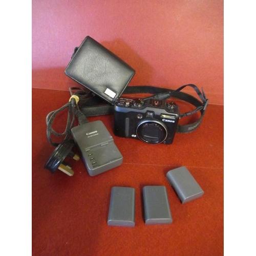 423 - CASED CANON G9 DIGITAL CAMERA THREE BATTERIES AND CHARGER