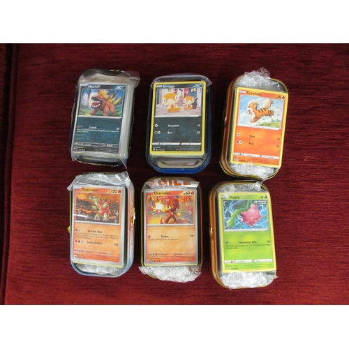 310 - BOX OF APPROXIMATELY 200 POKEMON CARDS AND TINS