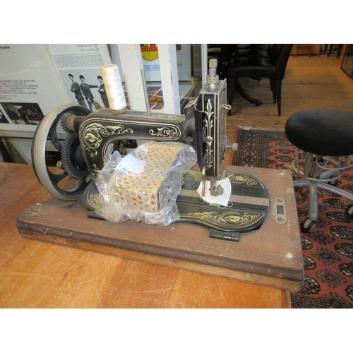 341 - CASED SEWING MACHINE