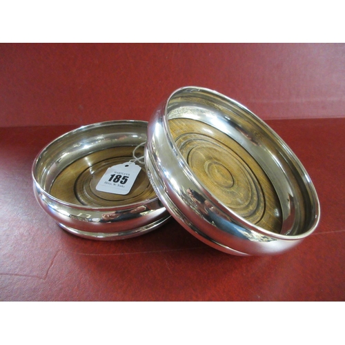 185 - PAIR OF SILVER WINE COASTERS