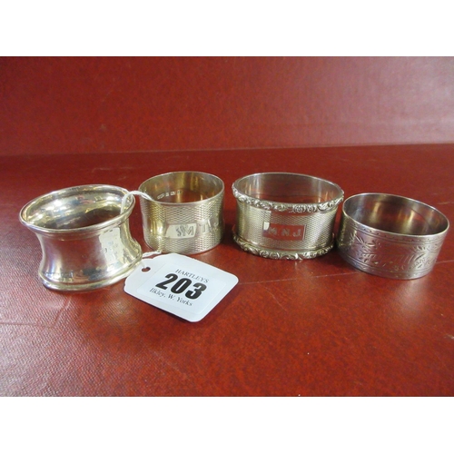 203 - FOUR SILVER NAPKIN RINGS