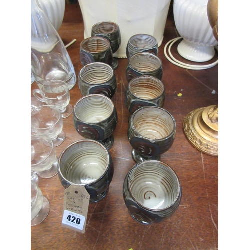 420 - SET OF TEN STONEWARE GOBLETS