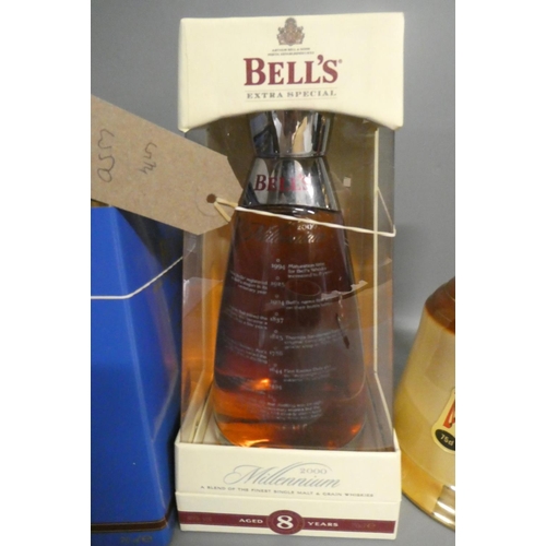 110 - Six Bell's whisky decanters, comprising a 70cl 8yr old Millennium boxed bottle, a 70cl boxed Queen 7... 