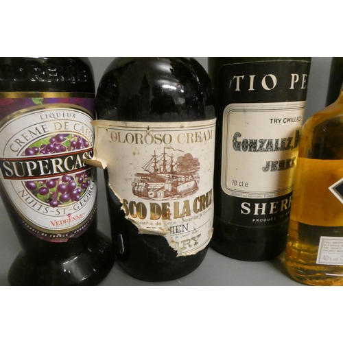 18 - Ten and four half bottles of mixed alcohol, including Laphroaig triple wood whisky, Dow's 1994 vinta... 