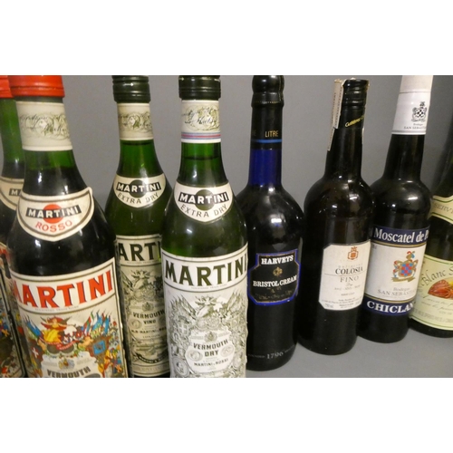 30 - Twenty seven bottles of mixed alcohol, including five Martini vermouth, one Martini vermouth rose, a... 