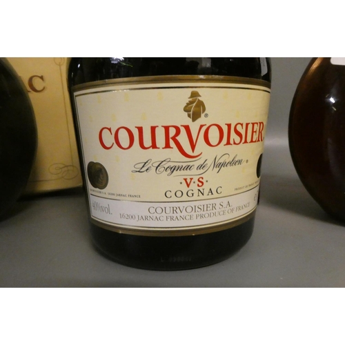 54 - Three bottles of cognac & armagnac comprising a boxed Courvoisier VS cognac, a boxed 12yr old Armagn... 