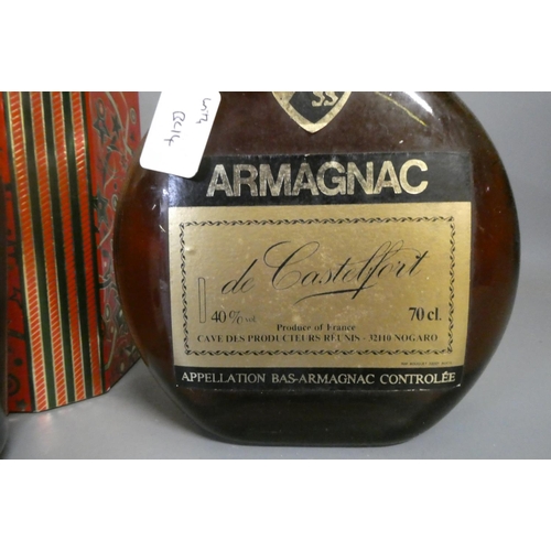 54 - Three bottles of cognac & armagnac comprising a boxed Courvoisier VS cognac, a boxed 12yr old Armagn... 