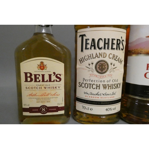 69 - Five bottles of blended scotch whisky, comprising a boxed 70cl Bell's special reserve, a 70cl Bell's... 