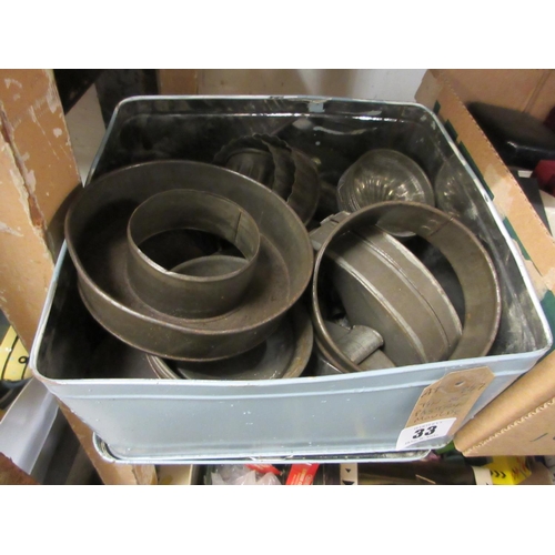 33 - TIN OF PASTRY MOULDS