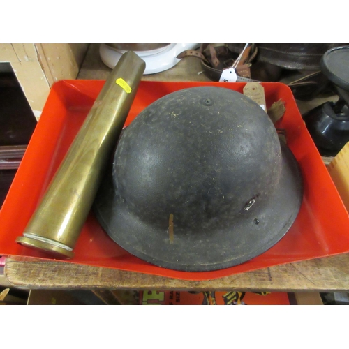 45 - WWII TOMMY HELMET AND A 1939 SHELL CASE