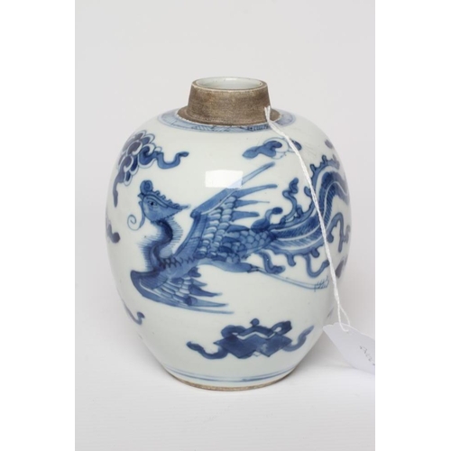 10 - A CHINESE PORCELAIN JAR of ovoid form, painted in underglaze blue with two dragons chasing the flami... 