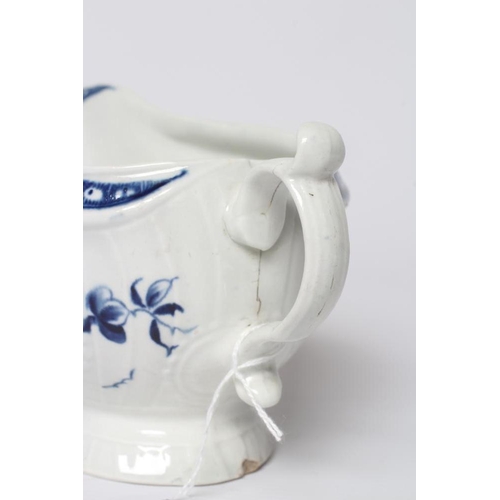 26 - A WORCESTER PORCELAIN STRAP FLUTE FLORAL SAUCEBOAT, c.1780, of pleat moulded shaped oval form, paint... 