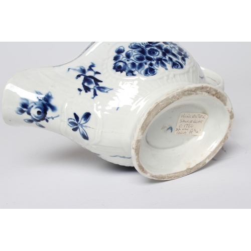 26 - A WORCESTER PORCELAIN STRAP FLUTE FLORAL SAUCEBOAT, c.1780, of pleat moulded shaped oval form, paint... 