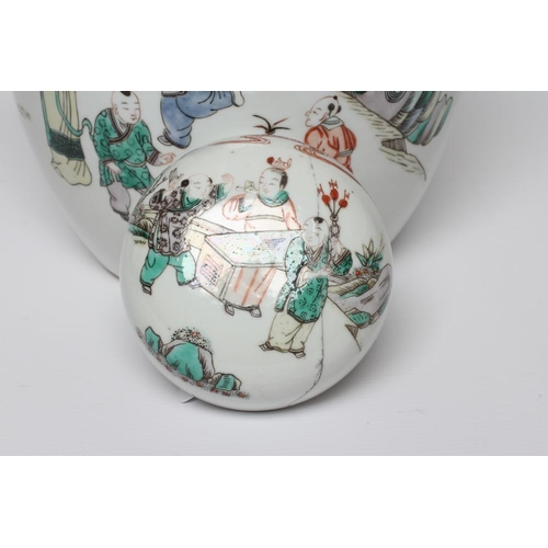 3 - A CHINESE PORCELAIN FAMILLE VERTE LARGE JAR AND COVER painted with four ladies and eight children at... 