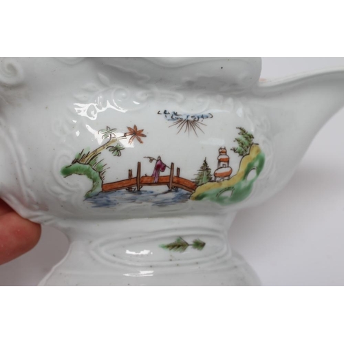 33 - A WORCESTER PORCELAIN HIGH-FOOTED SAUCEBOAT, c.1755, of shaped oval form with moulded panels, painte... 