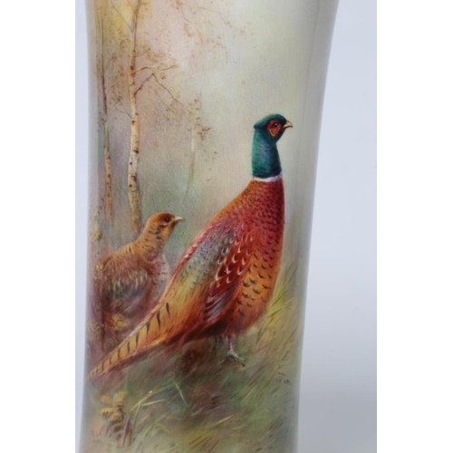 39 - A ROYAL WORCESTER CHINA VASE, 1954, of waisted cylindrical form painted by Harry Davis with a cock a... 