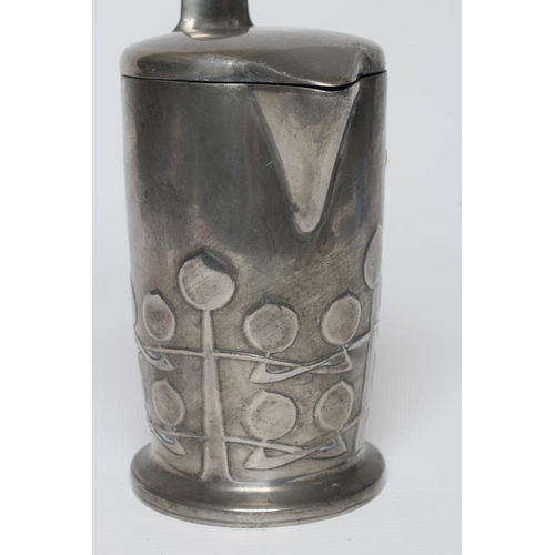 410 - ARCHIBALD KNOX FOR LIBERTY - an English Pewter hot milk jug of cylindrical form, the lower section w... 