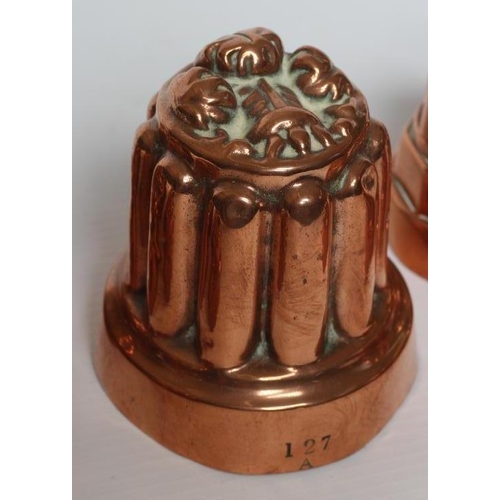 411 - TWO SETS OF THREE SMALL VICTORIAN COPPER JELLY MOULDS of fluted tapering cylindrical form, one set s... 