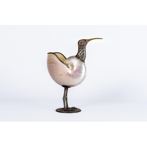 423 - A GABRIELLE BINAZZI BIRD, modern, the polished shell body with silvered metal cast neck, red glass e... 