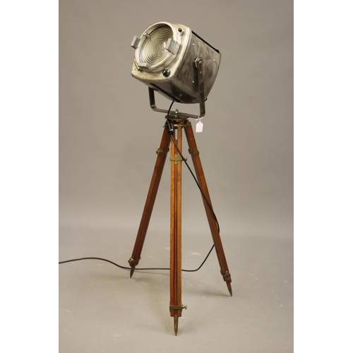 429 - A THEATRE STAGE LAMP, stamped 1918, the wooden tripod stand with brass fittings which read: 'Stand N... 