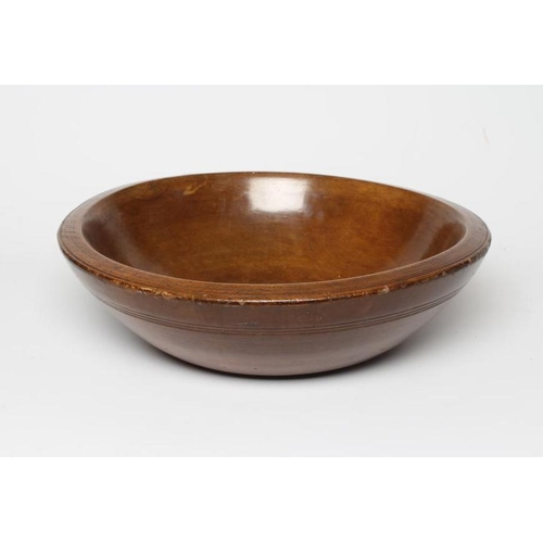 437 - A TREEN DAIRY BOWL, late 19th century, with incised banding to the exterior below the rim, 5