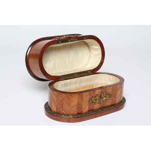 439 - A LOUIS XV STYLE KINGWOOD OVAL TRINKET BOX, early 20th century, with metal mounts and inset Sevres s... 