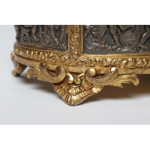 447 - A FRENCH GILDED ORMOLU OVAL JEWELLERY CASKET, late 19th century, with hinged top and medieval scenes... 