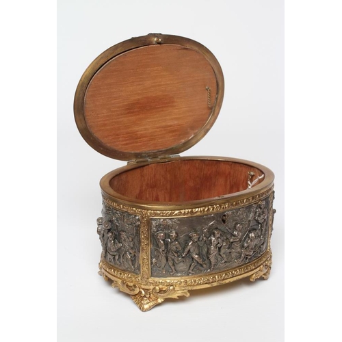 447 - A FRENCH GILDED ORMOLU OVAL JEWELLERY CASKET, late 19th century, with hinged top and medieval scenes... 