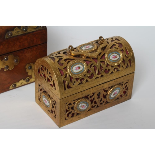 449 - A VICTORIAN FIGURED WALNUT DOMED TEA CADDY with gilt metal mounts and turquoise cabochons, the inter... 