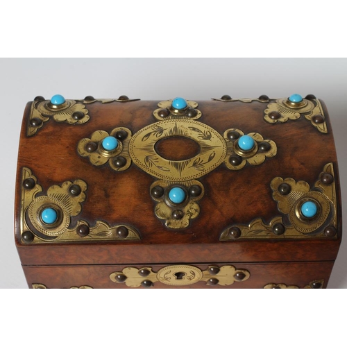 449 - A VICTORIAN FIGURED WALNUT DOMED TEA CADDY with gilt metal mounts and turquoise cabochons, the inter... 