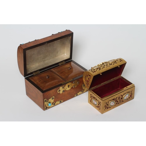 449 - A VICTORIAN FIGURED WALNUT DOMED TEA CADDY with gilt metal mounts and turquoise cabochons, the inter... 