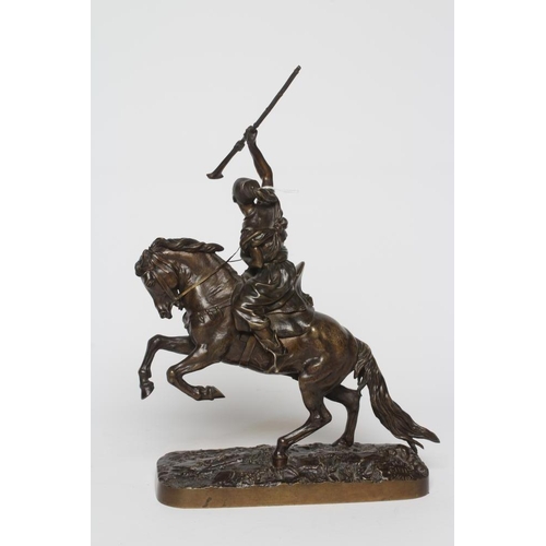 451 - EUGENE LANCERAY (Russian 1848-1886) A horseman with rifle held aloft on a naturalistic base, bronze,... 