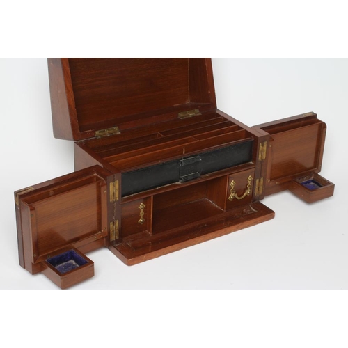 455 - A VICTORIAN WALNUT DESK TOP TIDY the hinged top opening to reveal a paper organiser with leather pen... 