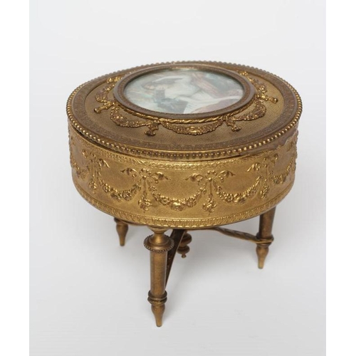 457 - A LOUIS XV ORMOLU AND GILT METAL OVAL JEWELLERY BOX, early 20th century, with swag decoration suppor... 