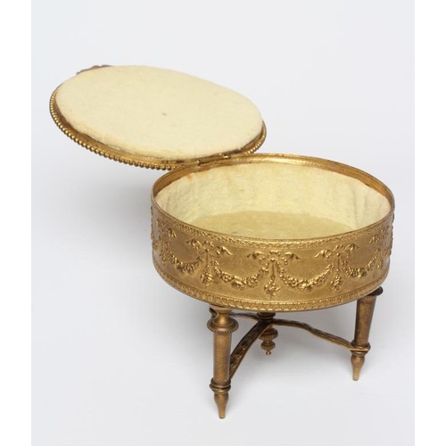 457 - A LOUIS XV ORMOLU AND GILT METAL OVAL JEWELLERY BOX, early 20th century, with swag decoration suppor... 