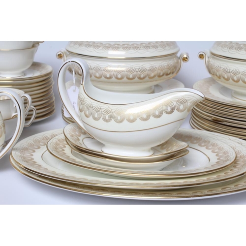 52 - OF ROYAL INTEREST - a Wedgwood china Golden Persephone pattern dinner service designed by Eric Ravil... 