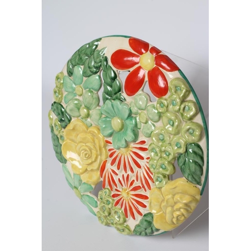 53 - A CLARICE CLIFF WILKINSON POTTERY BIZARRE ART DECO MARGUERITE WALL MEDALLION painted in bright green... 