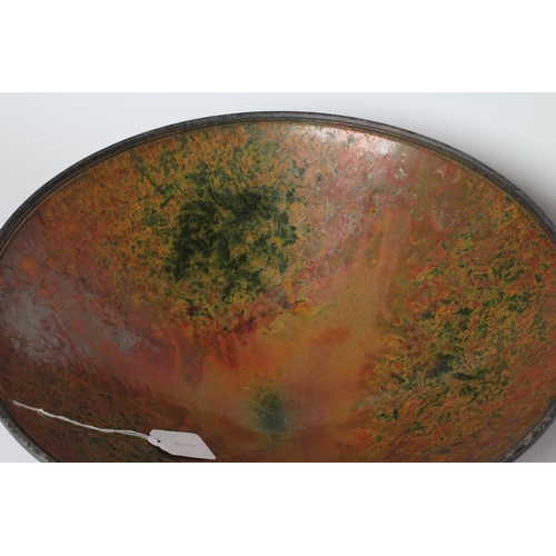 55 - ANDREW HILL (b.1964) - a large raku stoneware conical bowl with mottled bronze, copper and green gla... 