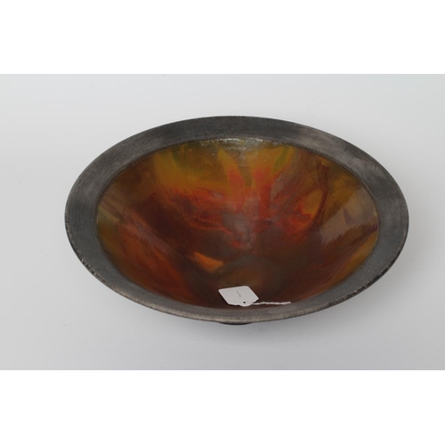 56 - ANDREW HILL (b.1964) - a raku stoneware pedestal conical bowl with mottled red and copper glaze, inc... 