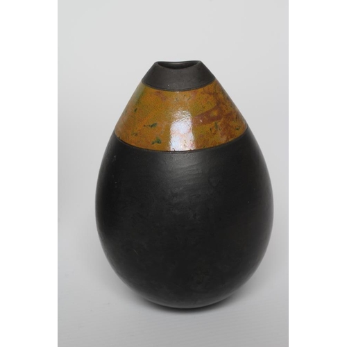 57 - ANDREW HILL (b.1964) - three raku stoneware ovoid vases with mottled glazes, incised initials to bas... 