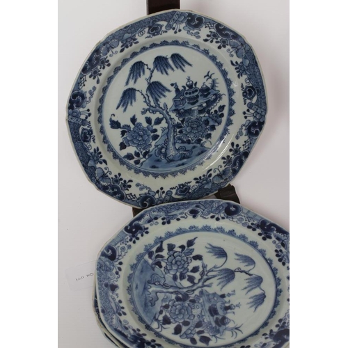 7 - A SET OF SIXTEEN CHINESE PORCELAIN OCTAGONAL PLATES painted in underglaze blue with vases on a table... 